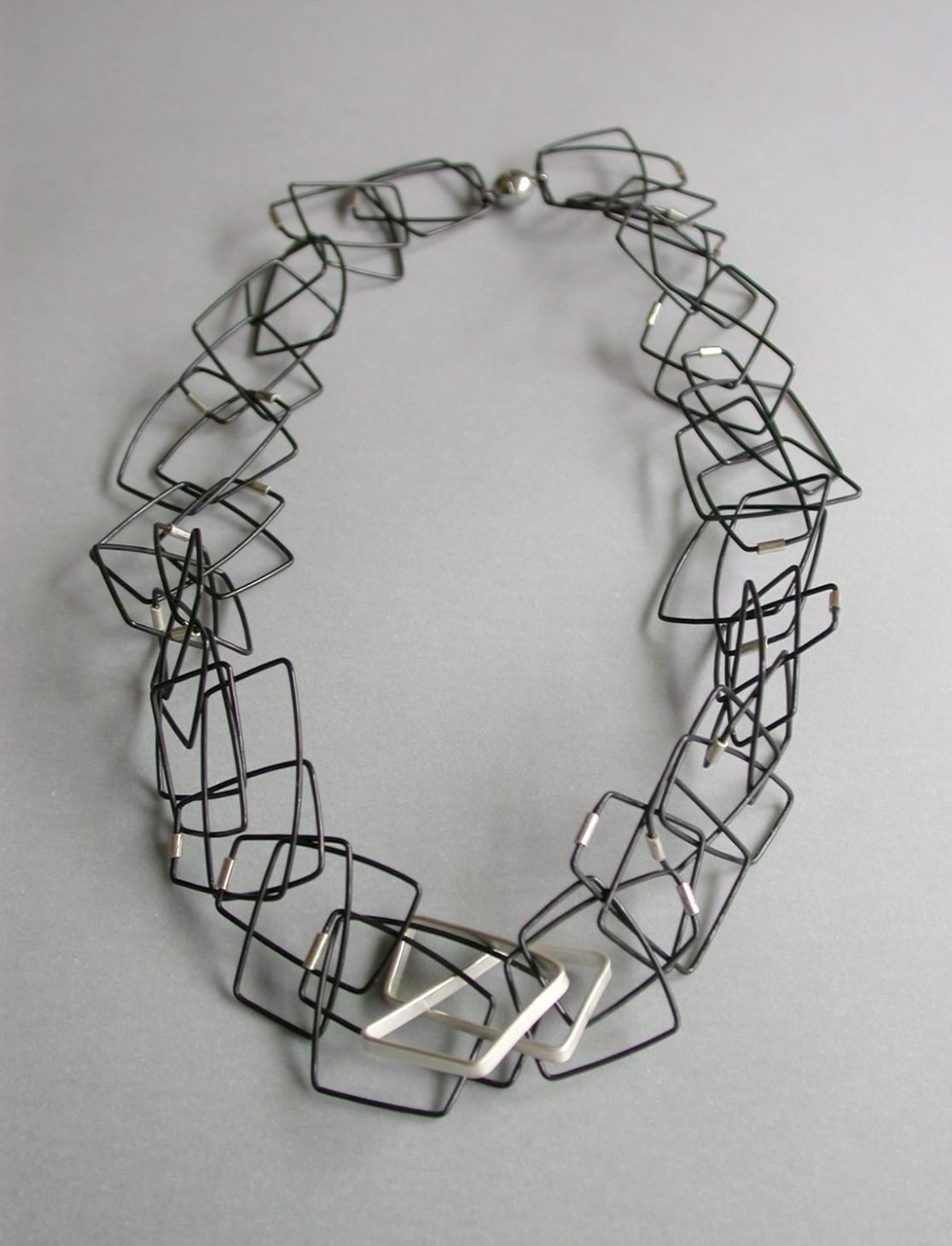 Geometric chain necklace with silver feature, by Szilvia György