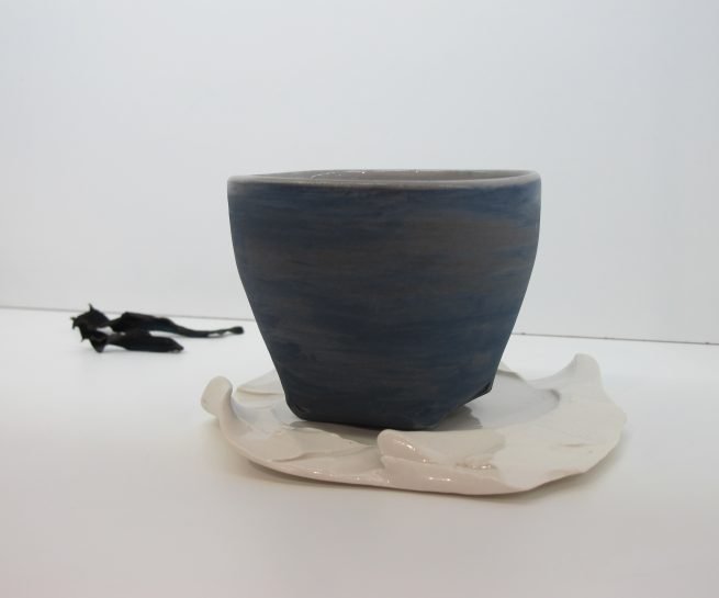 Blue cup white saucer